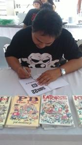Pol Medina signing a book